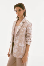 Load image into Gallery viewer, The Joseph Ribkoff Brocade Floral Print Blazer combines timeless charm with modern sophistication. Crafted from luxurious floral brocade fabric, this blazer is tailored with a classic notched collar and a single-button closure for a sleek, polished look. Versatile, this gorgeous jacket can be worn with denim to skirts. Fully lined for comfort, this standout piece adds a shimmering touch to your wardrobe.