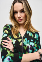 Load image into Gallery viewer, Elegance and comfort blend harmoniously in this beautiful silky knit tunic. Boasting a bold abstract print, the garment is tailored with chic three-quarter sleeves and an airy asymmetrical silhouette that creates an alluring look. The V-shaped neckline with zipper closure infuses modern flair into this classic design.