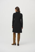 Load image into Gallery viewer, Experience contemporary sophistication with this luxurious silky knit dress. Its captivating animal print, elegant cowl neckline, and three-quarter sleeves radiate a sense of effortless chic. The dress is further enhanced by sleek sweater knit inserts and leatherette accents, while the A-line cut gracefully defines the silhouette.