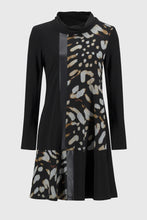 Load image into Gallery viewer, Experience contemporary sophistication with this luxurious silky knit dress. Its captivating animal print, elegant cowl neckline, and three-quarter sleeves radiate a sense of effortless chic. The dress is further enhanced by sleek sweater knit inserts and leatherette accents, while the A-line cut gracefully defines the silhouette.