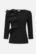 Load image into Gallery viewer, Black top with ruffle against a white background.