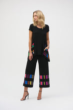 Load image into Gallery viewer, Elevate your style with these sophisticated silky pull-on pants. The chic culotte silhouette radiates poise, while vibrant striped print bands accentuate the hems, adding a touch of distinctive charm.