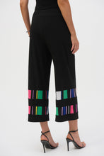 Load image into Gallery viewer, Elevate your style with these sophisticated silky pull-on pants. The chic culotte silhouette radiates poise, while vibrant striped print bands accentuate the hems, adding a touch of distinctive charm.