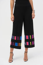 Load image into Gallery viewer, Elevate your style with these sophisticated silky pull-on pants. The chic culotte silhouette radiates poise, while vibrant striped print bands accentuate the hems, adding a touch of distinctive charm.