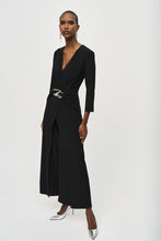 Load image into Gallery viewer, Boost your confidence in every stride with this stunning silky knit wrap jumpsuit. Designed with an overlapping culotte leg and elegant three-quarter sleeves, this garment exudes feminine grace and sophistication. Accentuate your figure with the waistline sash and sleek wrap neckline, while the delicate waist ornament adds a touch of unique charm.