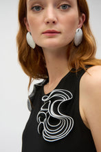 Load image into Gallery viewer, Embrace chic sophistication with the Joseph Ribkoff Silky Knit and Chiffon Fitted Top. designed with a crew neckline, sleeveless cut, and graceful ruffle detailing for a touch of elegance. Made from a blend of silky knit and chiffon fabrics, this lightweight top offers comfort and style in equal measure. Its timeless black and vanilla color palette ensures versatility for any wardrobe. Easy to care for, this fabulous top is perfect for layering or making a statement on its own.