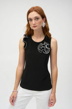 Load image into Gallery viewer, Embrace chic sophistication with the Joseph Ribkoff Silky Knit and Chiffon Fitted Top. designed with a crew neckline, sleeveless cut, and graceful ruffle detailing for a touch of elegance. Made from a blend of silky knit and chiffon fabrics, this lightweight top offers comfort and style in equal measure. Its timeless black and vanilla color palette ensures versatility for any wardrobe. Easy to care for, this fabulous top is perfect for layering or making a statement on its own.