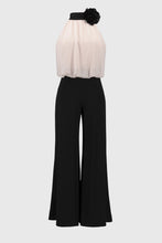 Load image into Gallery viewer, Exude sophistication in this wide leg jumpsuit, showcasing a contrasting chiffon blouson upper and a luxurious silky knit bottom. This one-piece garment features a mock collar with a lovely back bow tie. The fashionable wide leg combined with the shoulder-baring halter style creates a stunning ensemble. Part of Joseph Ribkoff's Signature collection.