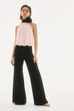 Load image into Gallery viewer, Exude sophistication in this wide leg jumpsuit, showcasing a contrasting chiffon blouson upper and a luxurious silky knit bottom. This one-piece garment features a mock collar with a lovely back bow tie. The fashionable wide leg combined with the shoulder-baring halter style creates a stunning ensemble. Part of Joseph Ribkoff's Signature collection.