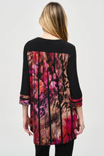 Load image into Gallery viewer, Experience ultimate comfort with this soft knit tunic featuring a stunning abstract striped burnout design. The high-low cut highlights the flared shape, while cuffed three-quarter sleeves add a polished touch. A zippered neckline adds a subtle yet eye-catching element, elevating the refined look of this tunic.