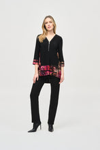 Load image into Gallery viewer, Experience ultimate comfort with this soft knit tunic featuring a stunning abstract striped burnout design. The high-low cut highlights the flared shape, while cuffed three-quarter sleeves add a polished touch. A zippered neckline adds a subtle yet eye-catching element, elevating the refined look of this tunic.