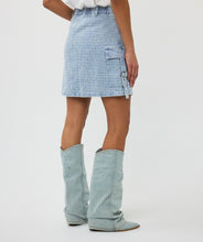 Load image into Gallery viewer, The EsQualo Distressed Jeans Skirt is a stylish denim skirt featuring a distressed design with cargo-style pockets and chic buckle details. It also has a unique button with inlaid rhinestones, adding a touch of elegance to its rugged charm. This versatile piece is perfect for casual outings or adding a trendy edge to your wardrobe.