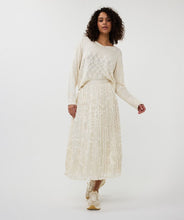 Load image into Gallery viewer, Designed for both elegance and ease, this pleated skirt features a stunning luminous, sheen finish and a comfortable elastic waistband, making it a go-to piece for various occasions. Made with durable polyester and lined with soft viscose, it offers a perfect combination of fashion and practicality. Pair it with heels for a night out or flats for a relaxed yet chic look.