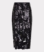 Load image into Gallery viewer, Long black sequin skirt with floral cutouts against a white background.