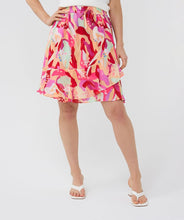 Load image into Gallery viewer, Asymmetric skirt with descending flounce in the beautiful print called "Heat Wave." Besides being super stylish, this skirt is also super comfortable due to the stretchy waistband. Style with your favorite white top and sandals for the perfect summer outfit.