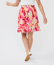 Load image into Gallery viewer, Asymmetric skirt with descending flounce in the beautiful print called "Heat Wave." Besides being super stylish, this skirt is also super comfortable due to the stretchy waistband. Style with your favorite white top and sandals for the perfect summer outfit.