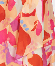 Load image into Gallery viewer, Asymmetric skirt with descending flounce in the beautiful print called "Heat Wave." Besides being super stylish, this skirt is also super comfortable due to the stretchy waistband. Style with your favorite white top and sandals for the perfect summer outfit.