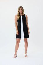 Load image into Gallery viewer, Make a statement with the Joseph Ribkoff Black and Vanilla Dress, designed for effortless elegance. This sleeveless, knee-length dress features a modern color-blocked design, perfect for both formal events and casual outings. Crafted from soft ITY fabric, it offers a comfortable stretch fit that moves with you. Designed for versatility, the Black/Vanilla color combination creates a striking contrast, making it perfect for both daytime chic and evening elegance.