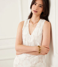 Load image into Gallery viewer, The Sonny Sleeveless Crochet Dress by Karen Kane is a fresh take on effortless elegance. Designed with intricate crochet detailing, this off-white sleeveless dress offers a breezy, lightweight feel perfect for warm-weather occasions. The cotton-blend fabric ensures comfort while maintaining a chic, sophisticated look.