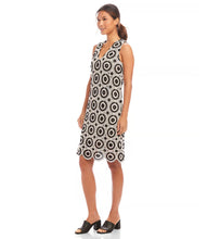 Load image into Gallery viewer, Turn heads in the Karen Kane Sleeveless Crochet Shift Dress, where timeless sophistication meets modern charm. Featuring a flattering shift silhouette, this dress boasts delicate woven crochet circles for a unique texture and visual appeal. The scalloped hem adds a graceful touch, perfect for any occasion—from casual gatherings to elegant soirées. Crafted from a blend of cotton and nylon, this sleeveless dress is lightweight and breathable, ensuring all-day comfort.