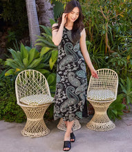 Load image into Gallery viewer, This elegant dress features a beautiful aqua blue paisley and floral design on a black background, perfect for spring or summer occasions. Its sleeveless style and relaxed fit make it versatile and comfortable, whether paired with sandals for a casual look or heels for a more formal event.