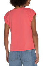 Load image into Gallery viewer, Make a statement in this essential raglan top. Featuring a sophisticated smocked shoulder detail that will certainly elevate your look. Add a touch of style to your wardrobe with this anything-but-basic knit top.