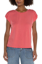 Load image into Gallery viewer, Make a statement in this essential raglan top. Featuring a sophisticated smocked shoulder detail that will certainly elevate your look. Add a touch of style to your wardrobe with this anything-but-basic knit top.