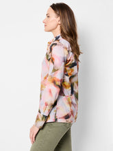 Load image into Gallery viewer, This multifunctional shirt serves as a must-have in any wardrobe, effortlessly providing comfort and style with its striking yet refined abstract floral pattern. The specially crafted Cotton Lawn fabric allows for breathable wear all day, along with the added artistic touch of the digital print. Whether heading to work, meeting up with friends, or attending a special event, the Smoky Petals Shirt is a chic and reliable choice that exudes confidence and sophistication.