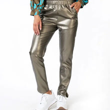 Load image into Gallery viewer, Our "Trousers Tregging PU" provides a combination of two different styles. Crafted from top-notch faux leather, these treggings offer a comfortable fit with a fashionable look. With its legging-style and a trouser design, this tregging has an unique presentation. Adding a subtle splash of gold helps to give it a modern, chic appearance. Color - Soft gold. Pull on. Faux leather. Elastic waistband. Functional front and back pockets.