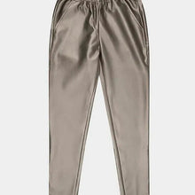 Load image into Gallery viewer, Our "Trousers Tregging PU" provides a combination of two different styles. Crafted from top-notch faux leather, these treggings offer a comfortable fit with a fashionable look. With its legging-style and a trouser design, this tregging has an unique presentation. Adding a subtle splash of gold helps to give it a modern, chic appearance. Color - Soft gold. Pull on. Faux leather. Elastic waistband. Functional front and back pockets.