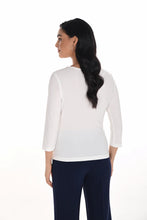 Load image into Gallery viewer, Woman wearing an ivory three quarter-sleeve top and navy pants against a white background.