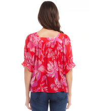 Load image into Gallery viewer, This square neck top is made from soft viscose fabric and features a delicate floral pattern that adds a touch of romance to your ensemble. It is suitable for both casual and special occasions, with short ruffled sleeves adding a playful and feminine touch. The fabric's softness also creates a pleasant movement with every step taken.