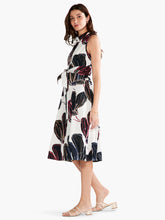 Load image into Gallery viewer, A classic and timeless design, our Sydney dress expertly combines black, white, and just the right amount of color in an oversized floral print. The silhouette is sleeveless and designed to fall below the knee. With pockets, a subtle collar, a sash at the waist this gorgeous dress is designed to flatter. Colors-White, black, blue, pink, beige. Woven dress. Shirt dress. Button front. Shirt collar. Sleeveless. Falls below knee.