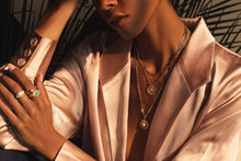 Load image into Gallery viewer, A brilliant necklace made for a goddess. The Stargazer Necklace features a shimmering gold sunburst pendant with a fiery opal center surrounded by sparkling CZs. This piece was made to reflect the light and be seen! Colors- Gold, white and clear. Opal Stone with Cubic Zirconia. 14K gold plate over brass. 20mm charm diameter. 18" chain + 2" extender.