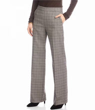 Load image into Gallery viewer, Plaid pants, brown long sleeve top and black shoes worn by a model against a white background.