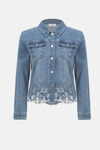 Load image into Gallery viewer, The Joseph Ribkoff Sybella Stretch Denim Jacket is a perfect fusion of classic and modern design. Made from eco-friendly Repreve® stretch denim, this piece features intricate eye-catching embroidery and sparkling rhinestones for a unique touch. With a traditional shirt collar, button closure, and functional chest pockets, it blends style and practicality. The medium blue wash makes it a versatile addition to any wardrobe, ideal for layering with both casual and dressy outfits.