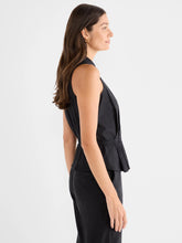 Load image into Gallery viewer, Woman wearing a black sleeveless top and black pants against a white background.
