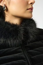 Load image into Gallery viewer, Close-up of a woman wearing a black jacket with a fur collar against a light background.