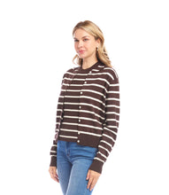 Load image into Gallery viewer, Woman wearing a brown and white striped cardigan and jeans against a white background.