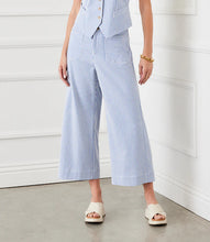 Load image into Gallery viewer, The Stripe Cropped Pants by Karen Kane offer a contemporary and polished aesthetic, perfect for effortless styling. Designed with wide legs and a cropped length, these pants feature striking blue and cream stripes for a bold yet sophisticated look. The high-rise waist provides a flattering fit, while the contrast stripe pockets add a stylish touch.