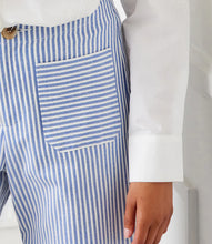 Load image into Gallery viewer, The Stripe Cropped Pants by Karen Kane offer a contemporary and polished aesthetic, perfect for effortless styling. Designed with wide legs and a cropped length, these pants feature striking blue and cream stripes for a bold yet sophisticated look. The high-rise waist provides a flattering fit, while the contrast stripe pockets add a stylish touch.