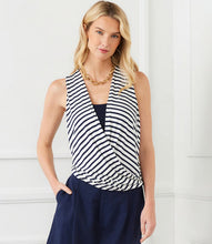 Load image into Gallery viewer, Ideal for the office, social events, or casual outings, this top embodies versatility. Its navy stripes provide a timeless appeal, and the faux wrap front design introduces a contemporary twist, offering a flattering and stylish silhouette. No need for an additional tank or cami underneath this fabulous top as there is a contrast insert added to create the appearance of an additional layer.