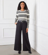 Load image into Gallery viewer, Elevate your style with our Stripe Ribbed Sweater. Made from a light fabric featuring a chic striped pattern, this sweater radiates sophistication and class. Its versatility allows for layering or wearing solo as an eye-catching item. Additionally, it offers supreme softness and comfort.