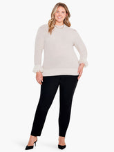 Load image into Gallery viewer, Bring a twist to your classic sweater with this statement-making fringe detail. The body has been knitted with a shaker stitch for a soft and comfortable feel. The pleats at the shoulder result in an effortless, feminine shape. This stunning style falls at the hips with ease. Color- Canva. Pullover sweater. Pleated sleeve with fringe cuff. Midweight. Regular fit. Crewneck. Bracelet sleeve.