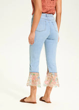 Load image into Gallery viewer, A perfect blend of classic charm and modern flair, these cropped flare jeans feature a contrasting floral fabric hem, adding a unique touch to a timeless silhouette. Designed for comfort and style, they offer a high-rise fit that flatters all body types.