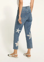 Load image into Gallery viewer, Step up your denim game with these chic Suzanne Pencil Crop Jeans! Featuring a flattering straight-leg fit and a trendy 7/8 length, these jeans are anything but ordinary. The delicate white floral embroidery and organza details add a fun and feminine touch, while the soft, stretchy fabric keeps you comfy all day long. Whether you're running errands or heading out for a casual lunch, these jeans are your go-to for effortless style.