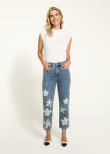 Load image into Gallery viewer, Step up your denim game with these chic Suzanne Pencil Crop Jeans! Featuring a flattering straight-leg fit and a trendy 7/8 length, these jeans are anything but ordinary. The delicate white floral embroidery and organza details add a fun and feminine touch, while the soft, stretchy fabric keeps you comfy all day long. Whether you're running errands or heading out for a casual lunch, these jeans are your go-to for effortless style.