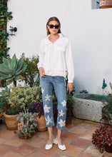 Load image into Gallery viewer, Step up your denim game with these chic Suzanne Pencil Crop Jeans! Featuring a flattering straight-leg fit and a trendy 7/8 length, these jeans are anything but ordinary. The delicate white floral embroidery and organza details add a fun and feminine touch, while the soft, stretchy fabric keeps you comfy all day long. Whether you're running errands or heading out for a casual lunch, these jeans are your go-to for effortless style.