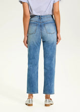 Load image into Gallery viewer, These eye-catching jeans in a medium wash, feature rhinestone embellishments on each leg, adding a touch of sparkle and elegance to the classic design. With a high-rise waist and a straight-leg shape, they offer a flattering fit and timeless style. The ankle length makes them perfect for pairing with heels or flats.