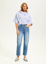 Load image into Gallery viewer, These eye-catching jeans in a medium wash, feature rhinestone embellishments on each leg, adding a touch of sparkle and elegance to the classic design. With a high-rise waist and a straight-leg shape, they offer a flattering fit and timeless style. The ankle length makes them perfect for pairing with heels or flats.